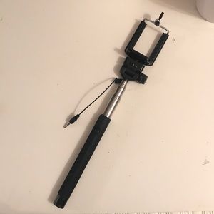 Five iPhone 5 phone cases and a selfie stick